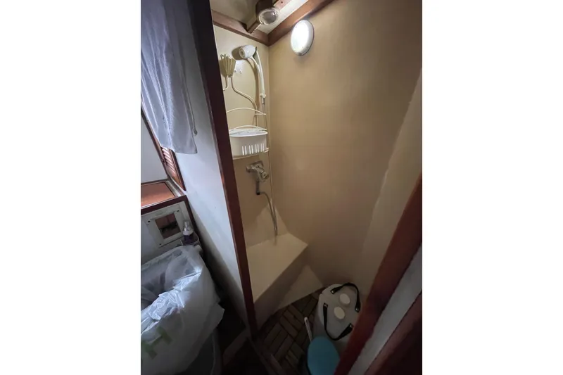 Slide: The Image of Compact shower area in a 1982 Kadey-Krogen 38 Dual Centerboard yacht. - 20