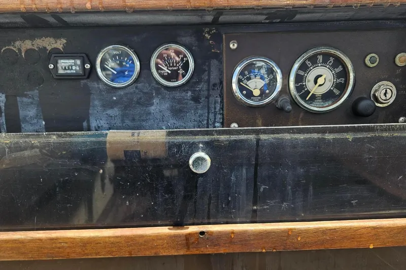 Slide: The Image of Control panel of a 1982 Kadey-Krogen 38 Dual Centerboard boat with gauges and switches. - 22