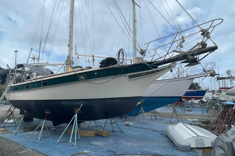 Slide: The Image of 1982 Kadey-Krogen 38 Dual Centerboard sailboat on stands in a boatyard. - 27