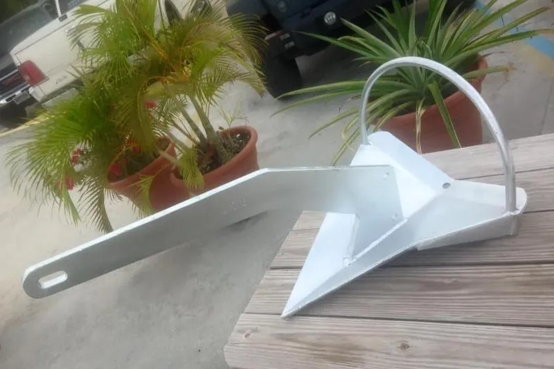 Slide: The Image of Anchor on wooden deck, Kadey-Krogen 38 Dual Centerboard, 1982 model, with potted plants nearby. - 30