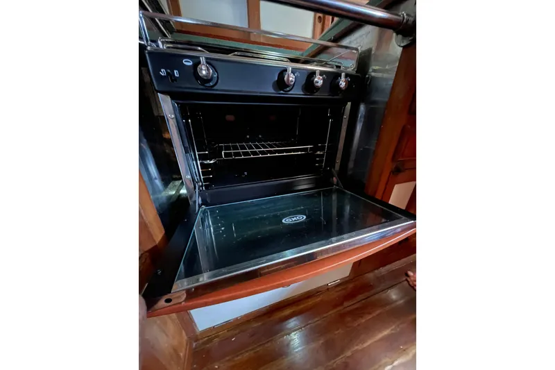 Slide: The Image of Open oven in 1982 Kadey-Krogen 38 Dual Centerboard yacht kitchen, showcasing modern design. - 8