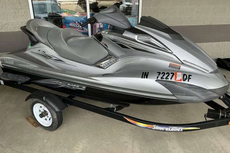 The Image of 2008 Yamaha WaveRunner FX Cruiser SHO on trailer, parked outside a building. - 1