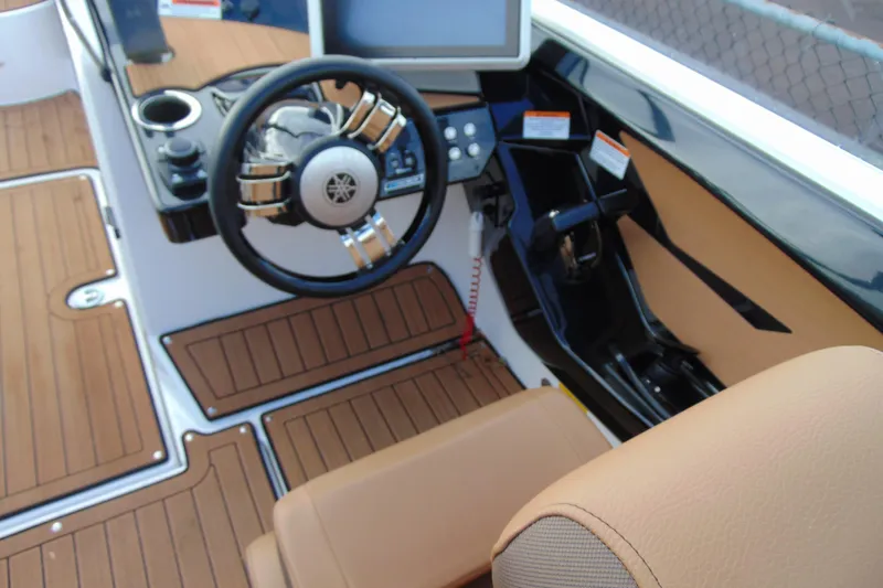 Slide: The Image of 2024 Yamaha Boats 222SD cockpit with steering wheel and modern dashboard controls. - 7