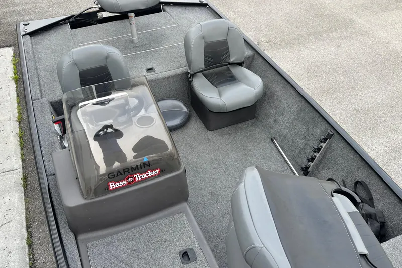 Slide: The Image of 2020 Tracker Bass Tracker Classic XL boat interior with gray seating and Garmin equipment. - 9