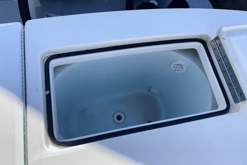 Slide: The Image of Open storage compartment on a 2023 Regulator 28 boat, showcasing interior space. - 13
