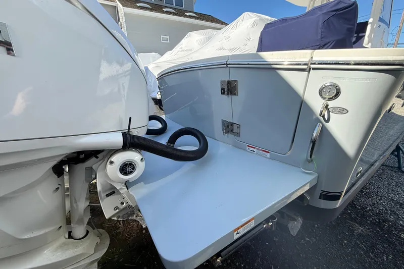 Slide: The Image of 2023 Regulator 28 boat stern with engine and swim platform detail. - 21
