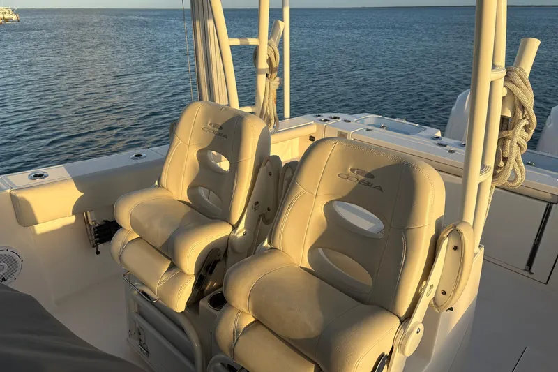 Slide: The Image of 2019 Cobia 320 Center Console boat seats with ocean view. - 20