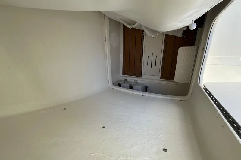 Slide: The Image of Interior view of 2026 Bulls Bay 255 Center Console boat cabin, featuring sleek design and storage. - 12