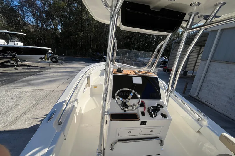 Slide: The Image of 2026 Bulls Bay 255 Center Console boat with sleek design and modern controls. - 13