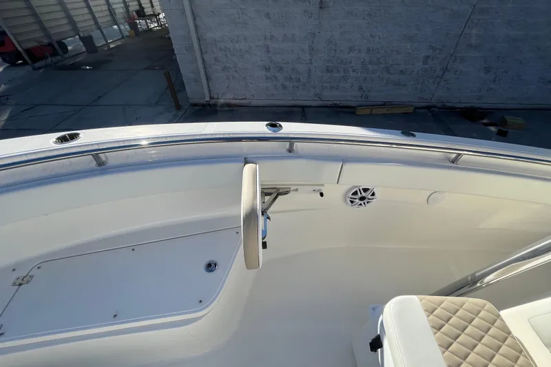 Slide: The Image of 2026 Bulls Bay 255 Center Console boat interior with seating and speaker. - 17