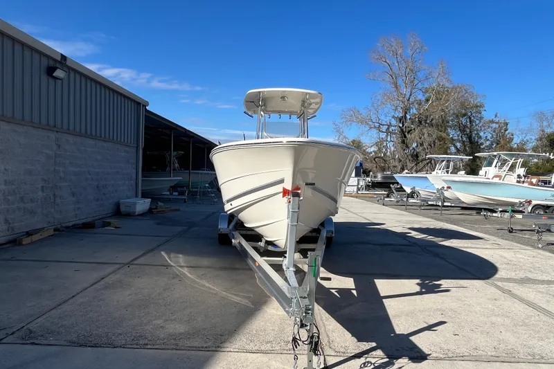 Slide: The Image of 2026 Bulls Bay 255 Center Console boat on trailer in outdoor storage area. - 2