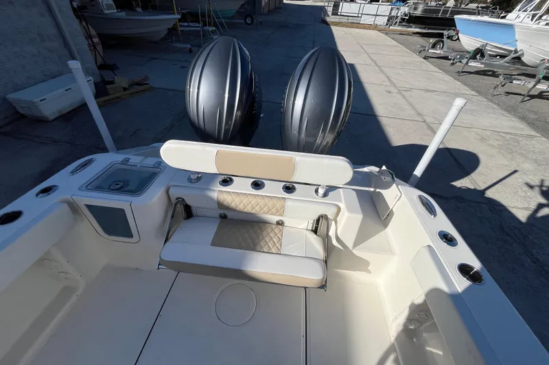 Slide: The Image of 2026 Bulls Bay 255 Center Console boat with dual engines and seating area. - 21