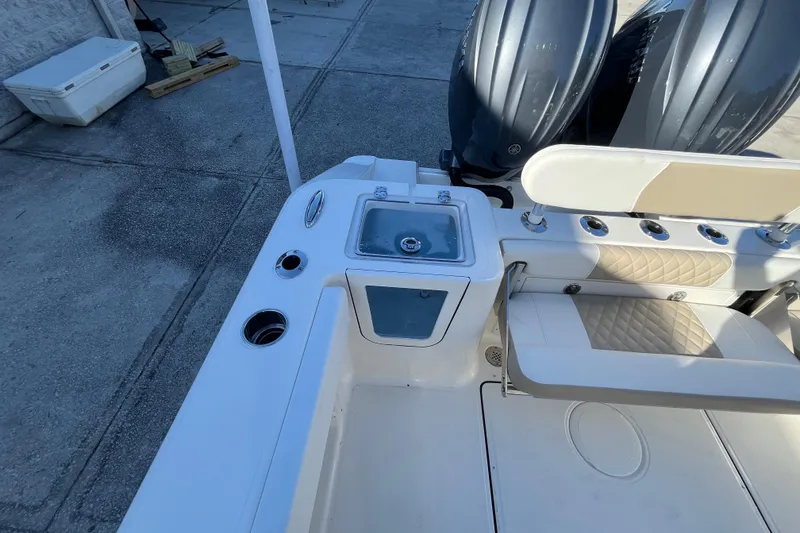 Slide: The Image of 2026 Bulls Bay 255 Center Console boat with dual engines and seating area. - 22