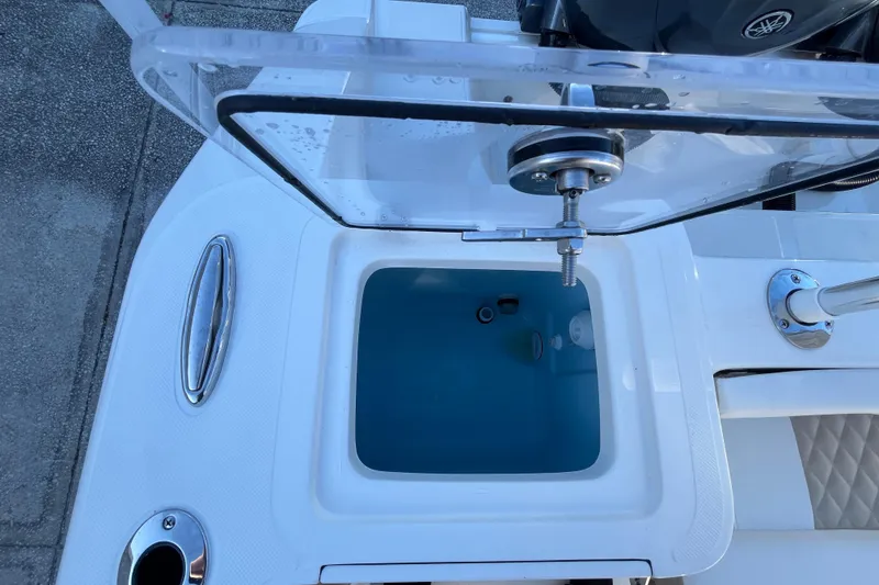 Slide: The Image of 2026 Bulls Bay 255 Center Console boat livewell with open lid and stainless steel fittings. - 23
