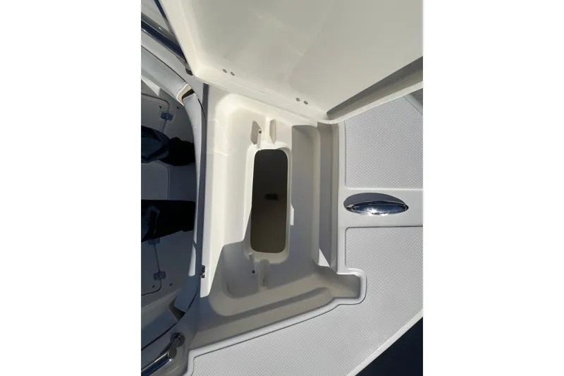 Slide: The Image of 2026 Bulls Bay 255 Center Console boat storage compartment, open and empty. - 25