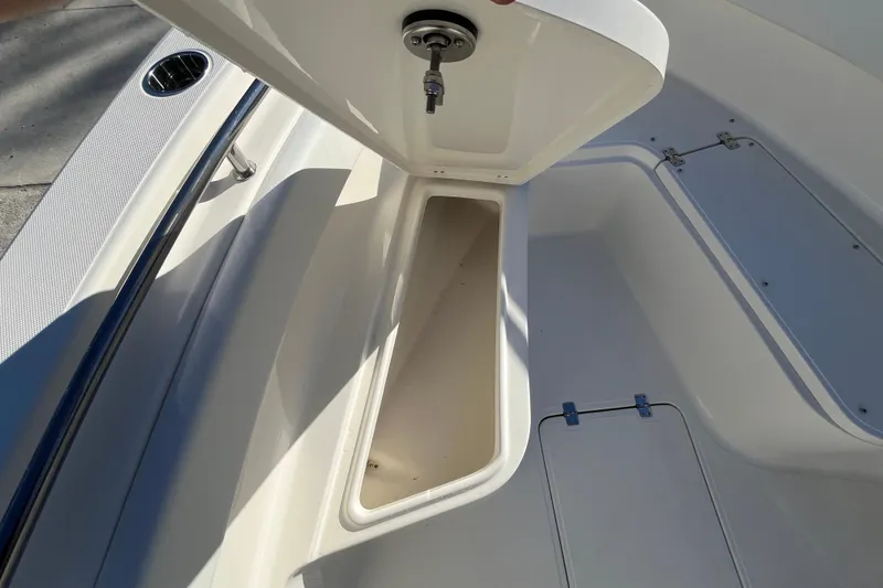Slide: The Image of Open storage compartment on a 2026 Bulls Bay 255 Center Console boat. - 27