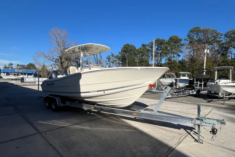Slide: The Image of 2026 Bulls Bay 255 Center Console boat on trailer in outdoor dealership lot. - 3