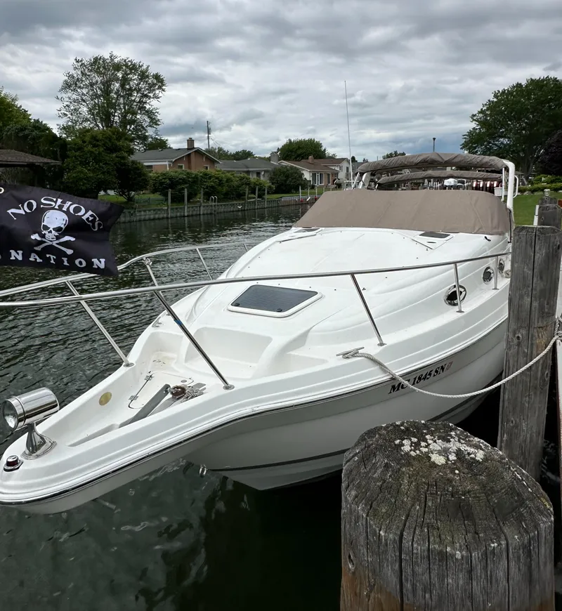 Slide: The Image of 2003 Regal Commodore 2860 boat docked with No Shoes Nation flag. - 11