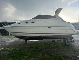 Slide: The Image of 2003 Regal Commodore 2860 boat on land, side view. - 12