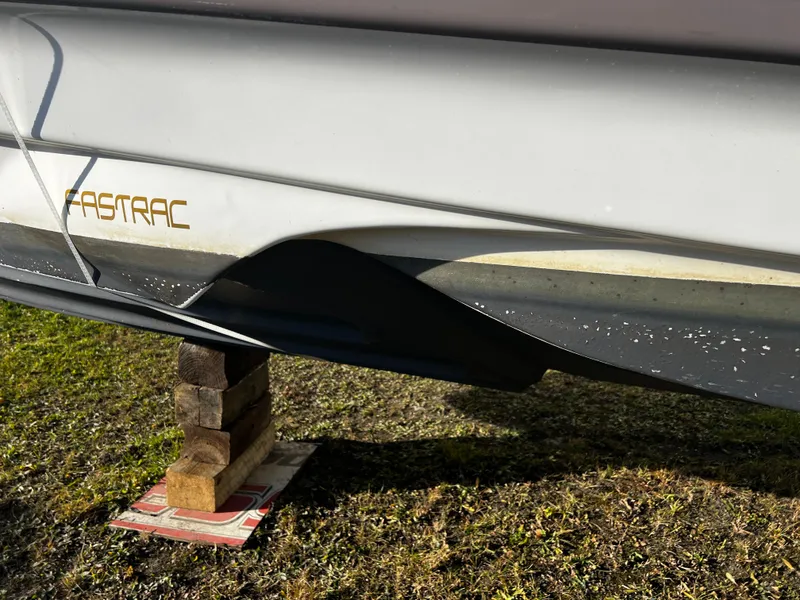 Slide: The Image of 2003 Regal Commodore 2860 boat hull on blocks, showing FasTrac design. - 17