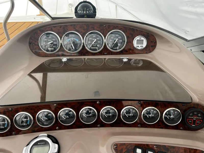 Slide: The Image of Dashboard of a 2003 Regal Commodore 2860 boat with various gauges and controls. - 21
