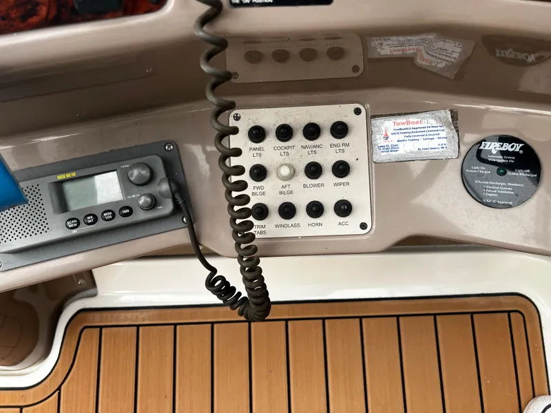 Slide: The Image of Control panel of a 2003 Regal Commodore 2860 boat with radio and switches. - 22