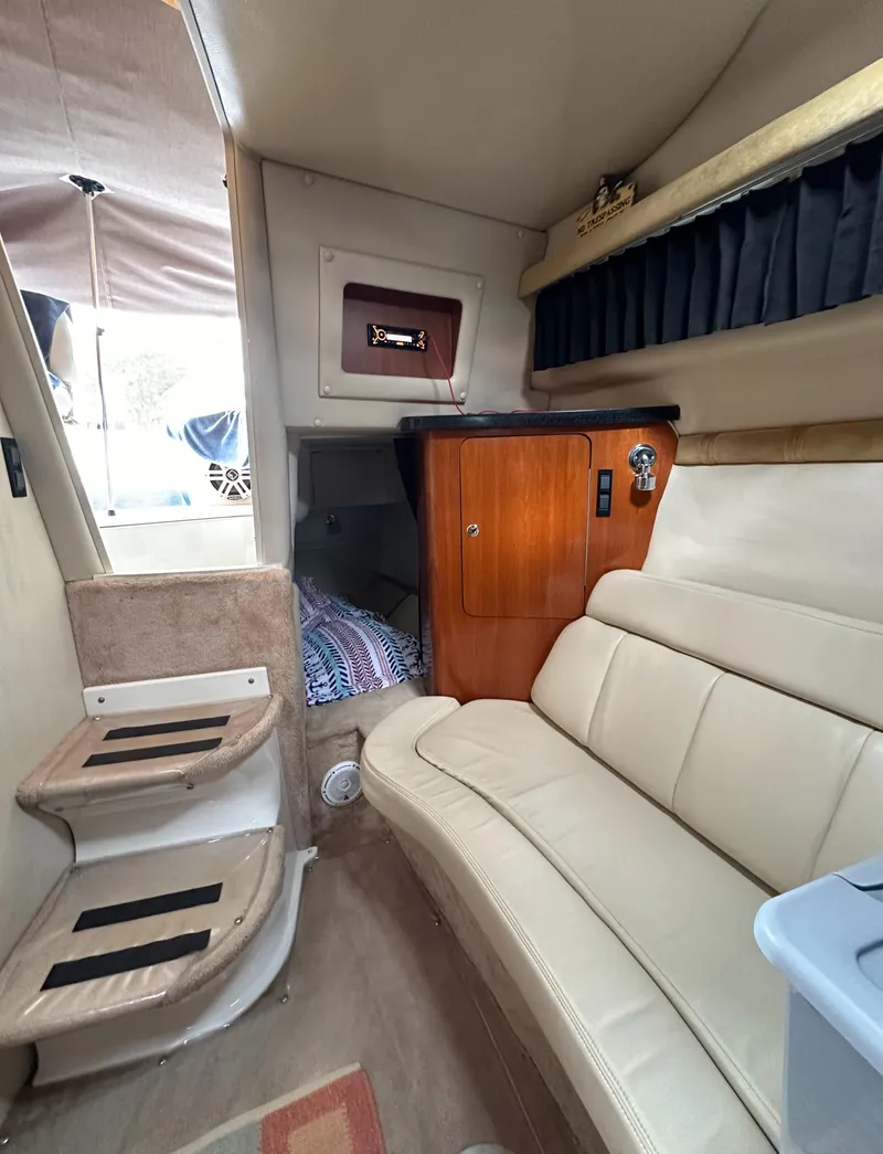 Slide: The Image of Interior of 2003 Regal Commodore 2860 with beige seating and wooden cabinetry. - 35