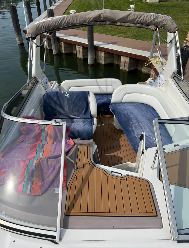 Slide: The Image of 2003 Regal Commodore 2860 boat interior with seating and wooden deck. - 5
