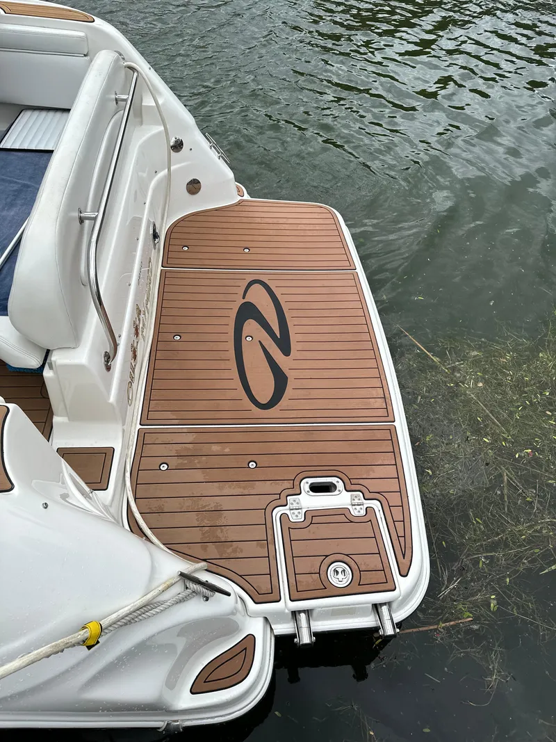 Slide: The Image of 2003 Regal Commodore 2860 boat swim platform with teak decking. - 9