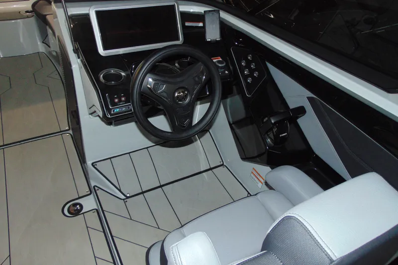 Slide: The Image of 2024 Yamaha Boats 255XD cockpit with modern steering wheel and digital display. - 10