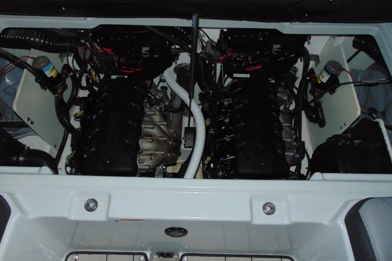 Slide: The Image of Engine compartment of 2024 Yamaha Boats 255XD, showcasing dual engines and wiring. - 15