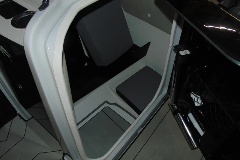Slide: The Image of Interior view of 2024 Yamaha Boats 255XD, showcasing seating and storage area. - 16