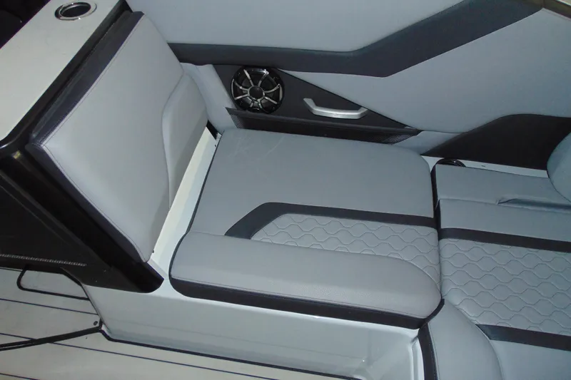 Slide: The Image of 2024 Yamaha Boats 255XD interior seating with sleek design and integrated speaker. - 6