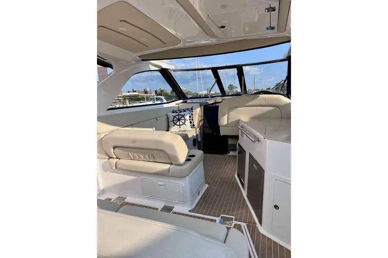 Slide: The Image of Interior of 2018 Regal 35 Sport Coupe yacht with beige seating and modern amenities. - 3