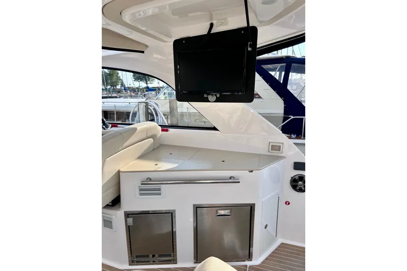 Slide: The Image of Interior of a 2018 Regal 35 Sport Coupe yacht with seating and entertainment system. - 5