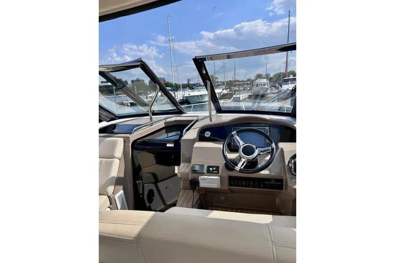 Slide: The Image of Interior view of 2018 Regal 35 Sport Coupe yacht cockpit with steering wheel and dashboard. - 6