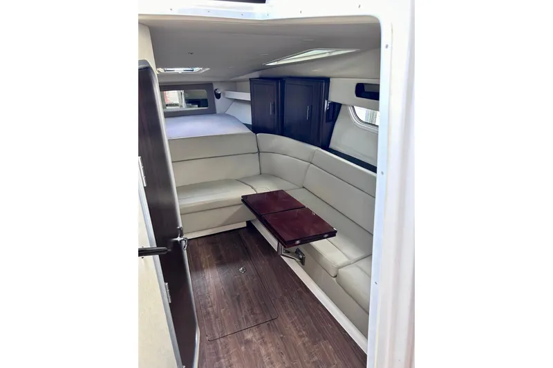 Slide: The Image of Interior of 2018 Regal 35 Sport Coupe with elegant seating and wooden table. - 9