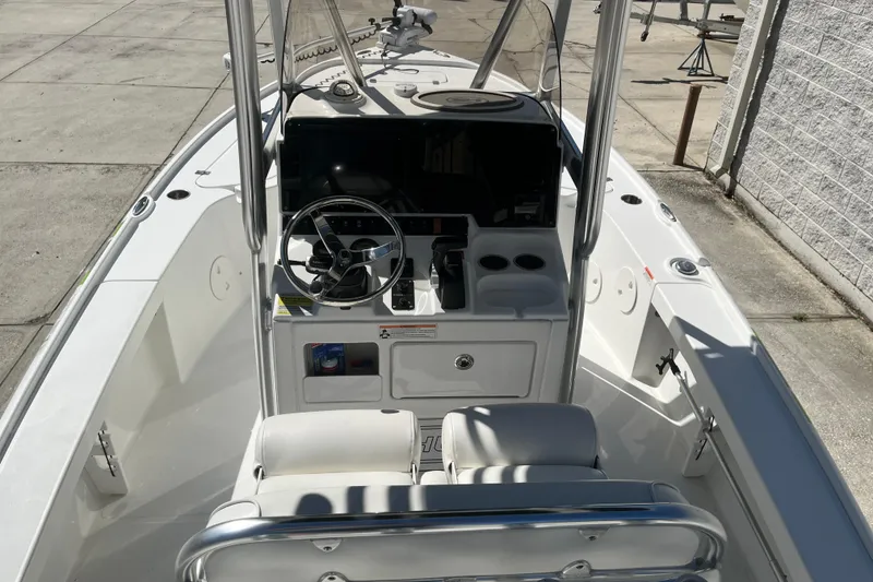 Slide: The Image of 2019 Sea Hunt BX 22 BR boat interior with steering console and seating. - 15