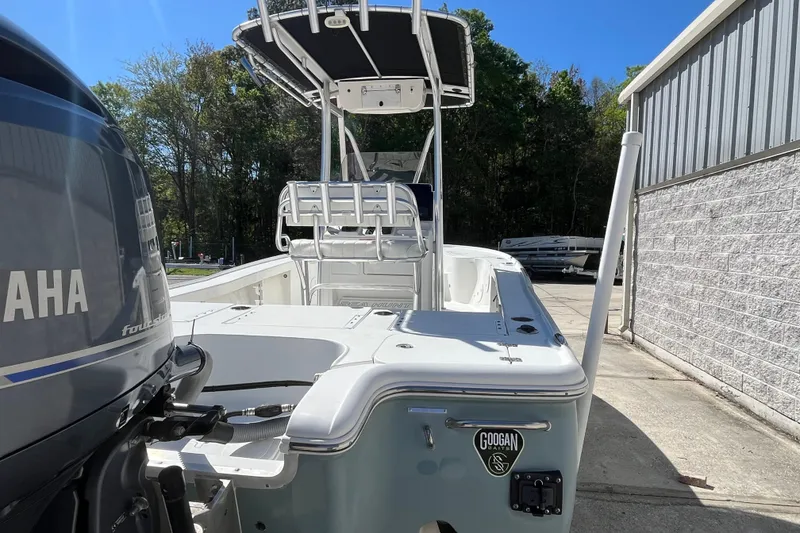 Slide: The Image of 2019 Sea Hunt BX 22 BR boat with Yamaha engine, parked outdoors near a building. - 23