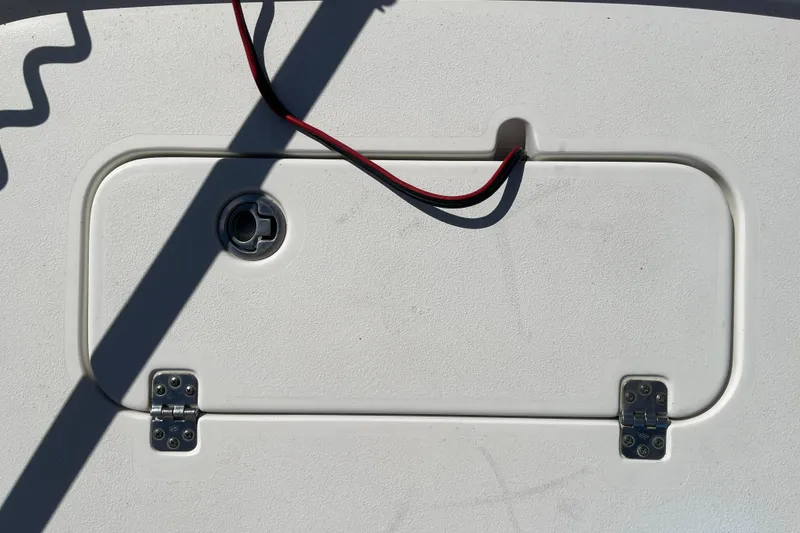 Slide: The Image of Hinged compartment on 2019 Sea Hunt BX 22 BR boat deck with wiring. - 24