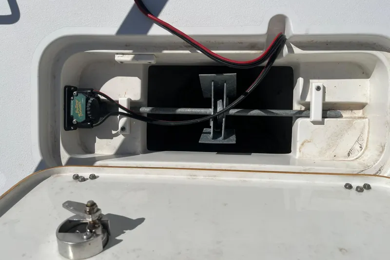 Slide: The Image of 2019 Sea Hunt BX 22 BR boat compartment with wiring and metal components. - 25