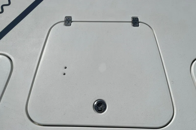 Slide: The Image of 2019 Sea Hunt BX 22 BR boat hatch with metal hinges and latch. - 26