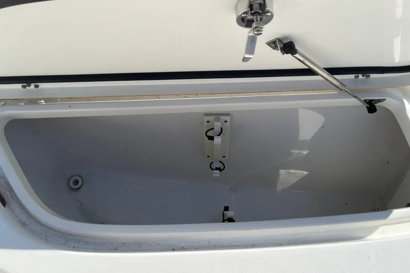 Slide: The Image of Open storage compartment on a 2019 Sea Hunt BX 22 BR boat. - 27