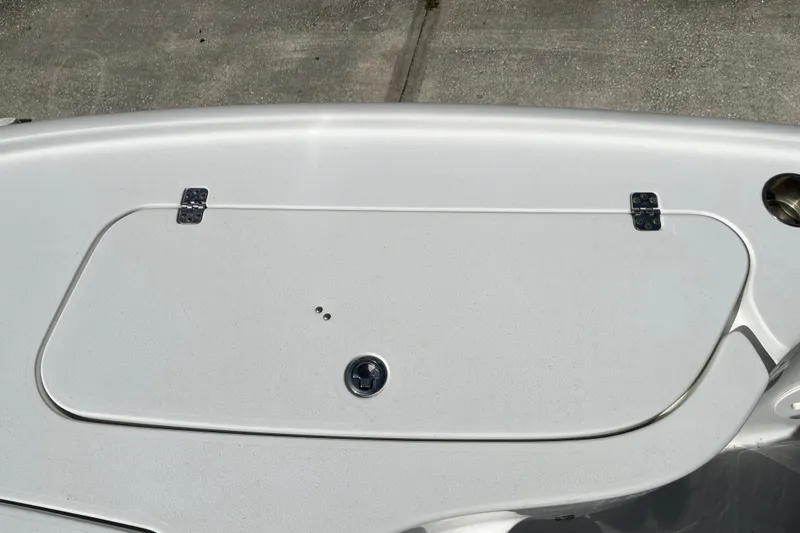 Slide: The Image of 2019 Sea Hunt BX 22 BR boat deck with storage compartment and hinges. - 29