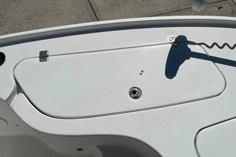 Slide: The Image of 2019 Sea Hunt BX 22 BR boat deck with storage compartment and latch. - 31