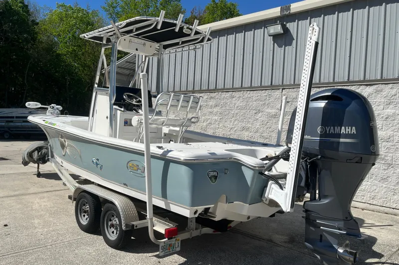 Slide: The Image of 2019 Sea Hunt BX 22 BR boat with Yamaha engine on trailer, parked outdoors. - 8
