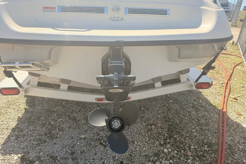 Slide: The Image of Rear view of a 2004 Crownline 180 BR boat with visible propeller. - 3