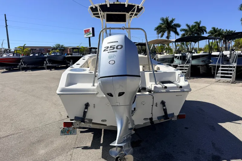 Slide: The Image of 2015 Sea Chaser 22 HFC boat with Honda 250 engine, parked outdoors. - 10