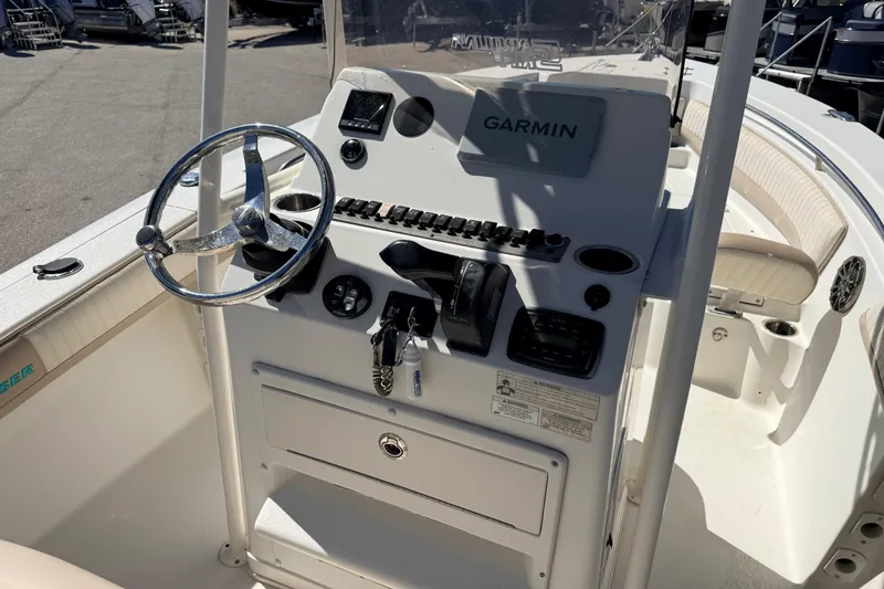 Slide: The Image of 2015 Sea Chaser 22 HFC boat console with Garmin navigation system and steering wheel. - 13