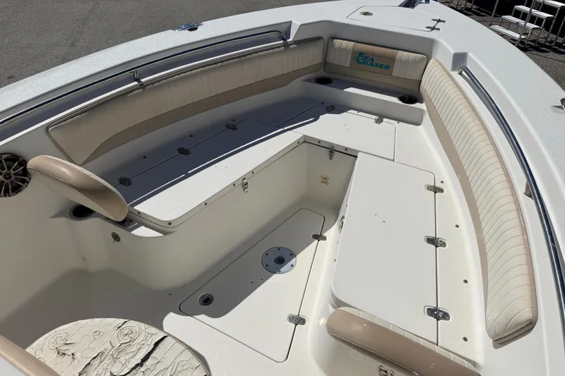 Slide: The Image of 2015 Sea Chaser 22 HFC boat interior with cushioned seating and storage compartments. - 14